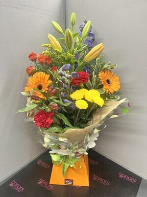 Bright and cheerful Florist choice hand tied