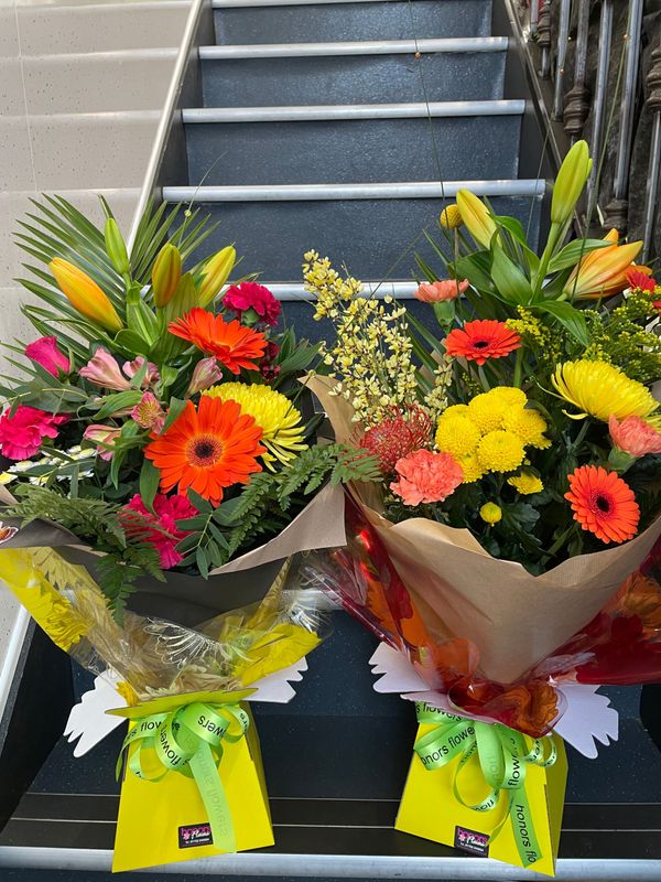 Bright and cheerful Florist choice hand tied