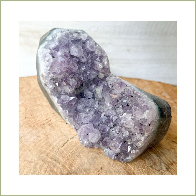 Amethyst geode half with natural crystal points
