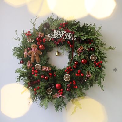 19-inch fresh Christmas wreath decorated with gingerbread figure, red ornaments, dried citrus slices, pinecones, cinnamon sti