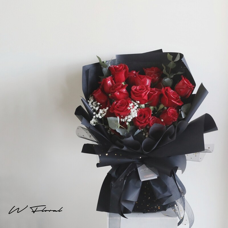 19 red rose bouquet with baby’s breath and seasonal greenery