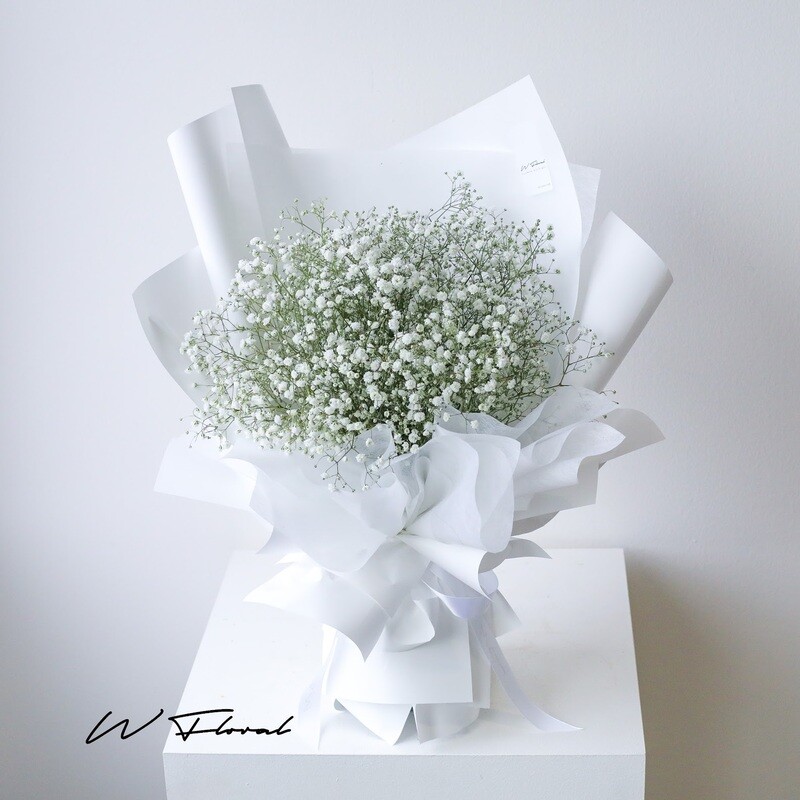 White baby’s breath bouquet with modern wrapping