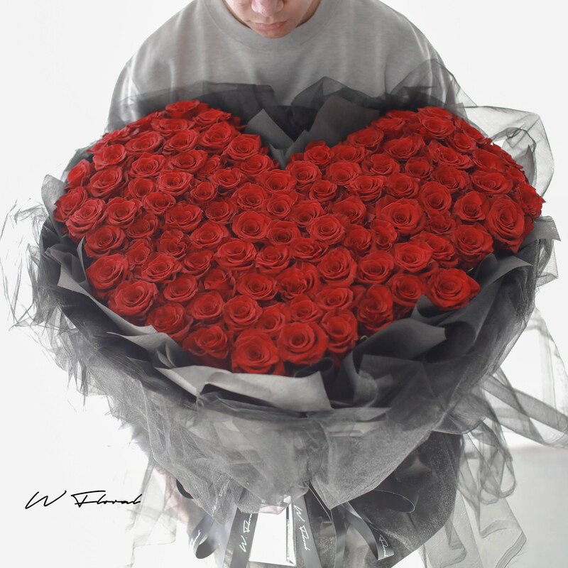 Romantic red rose bouquet wrapped in delicate chiffon fabric for Toronto delivery