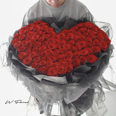 Romantic red rose bouquet wrapped in delicate chiffon fabric for Toronto delivery