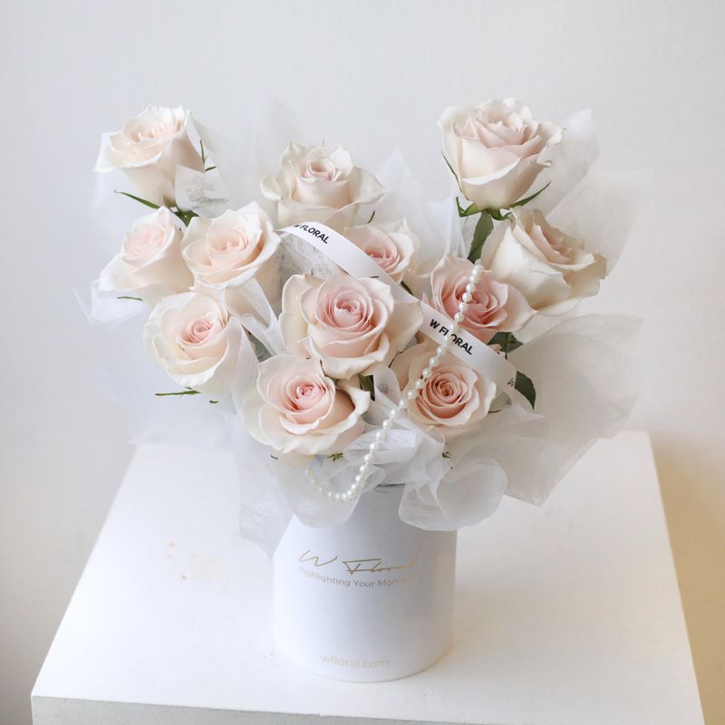 Pink rose box arrangement with premium fresh roses in garden style