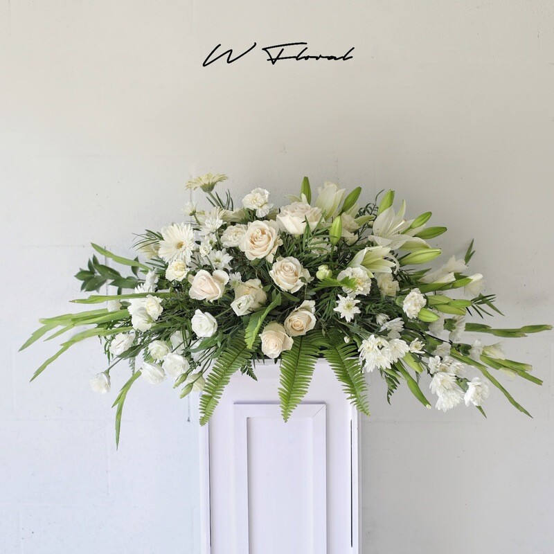 serene white funeral casket spray Toronto delivery