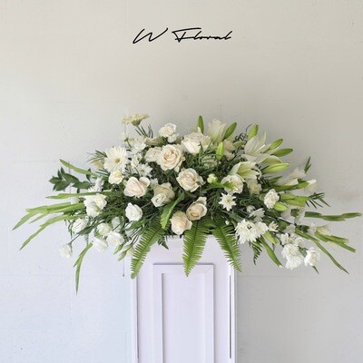 serene white funeral casket spray Toronto delivery