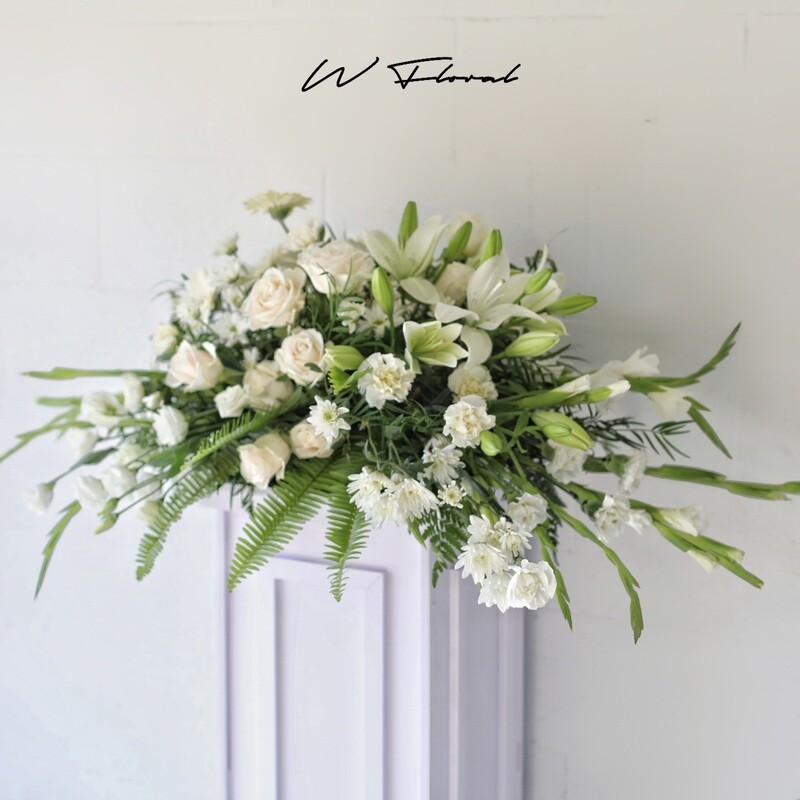Serene White Funeral Casket Spray