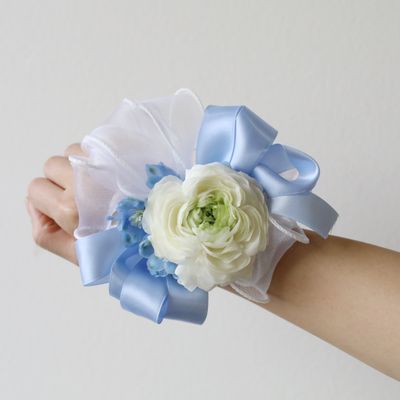 Light blue fresh flower wrist corsage for wedding or prom