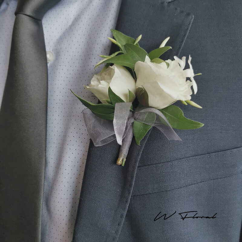 White fresh flower wedding boutonniere on grey suit by W Floral Toronto