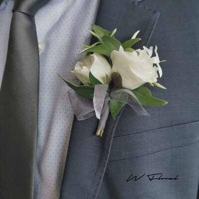 White fresh flower wedding boutonniere on grey suit by W Floral Toronto
