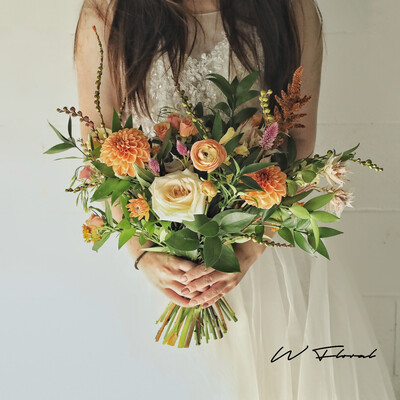 Natural white and green wedding bouquet with roses and greenery