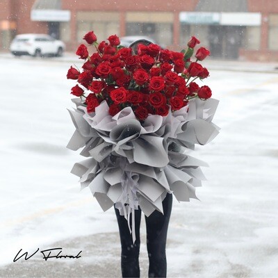 Grand luxurious red rose bouquet with premium fresh roses