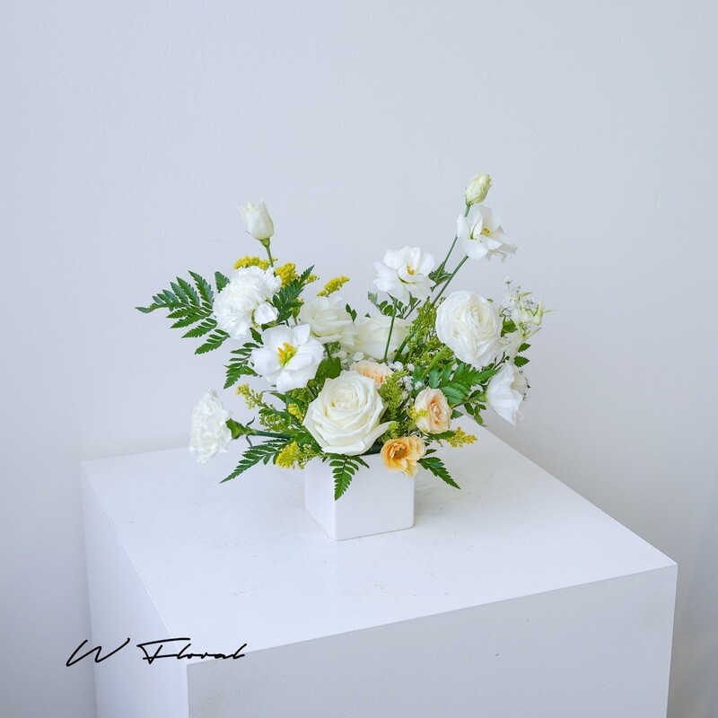 Wedding table centrepiece with fresh seasonal flowers