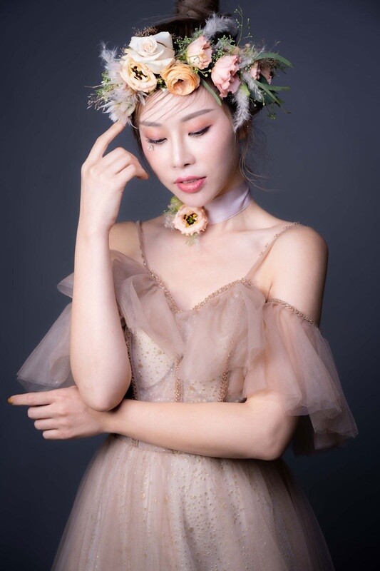 Romantic bridal flower crown with fresh roses and seasonal blooms