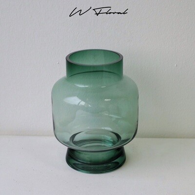 Emerald green glass vase with modern wide-waist silhouette