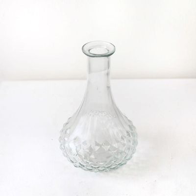 Transparent glass bud vase for single stems and delicate flowers