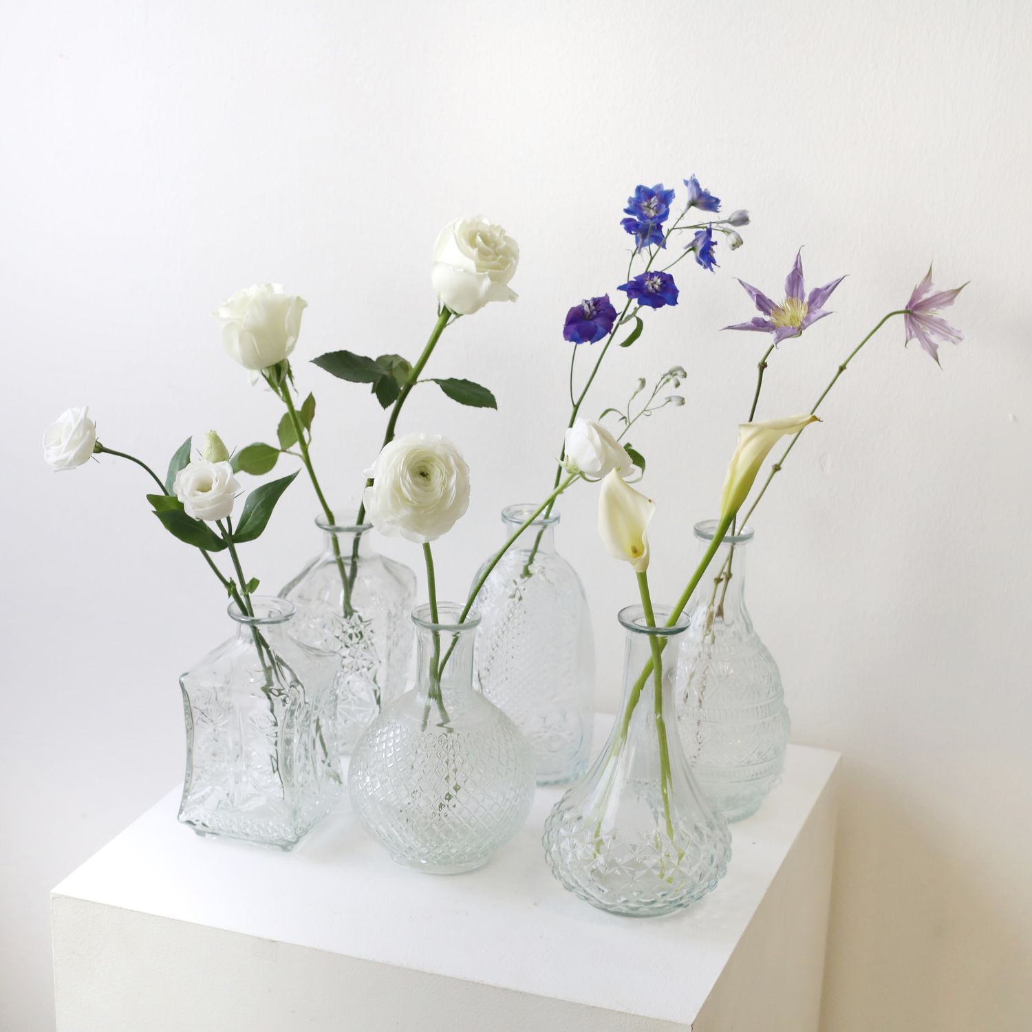Sculptural clear glass bud vase with modern artistic silhouette