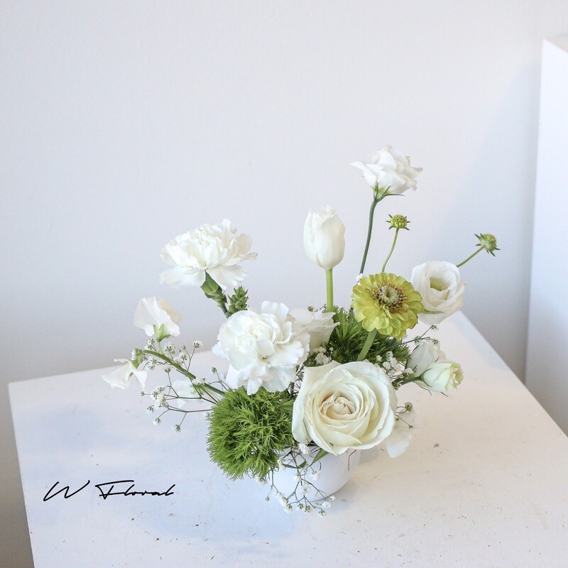 Small white floral centrepiece for wedding cocktail table