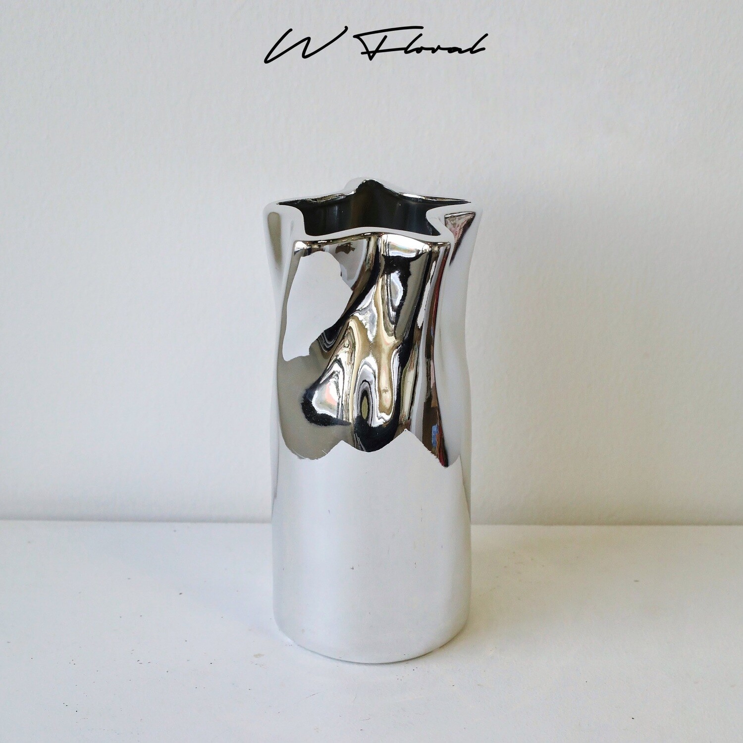 Sculptural silver vase with modern textured silhouette