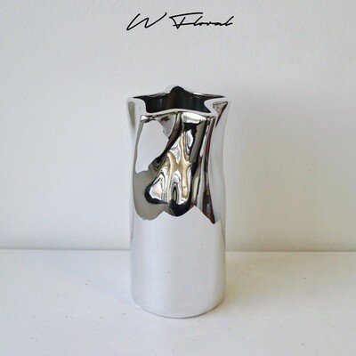 Sculptural silver vase with modern textured silhouette