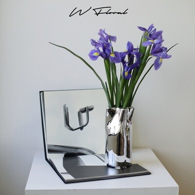 Silver-toned decorative flower vase with artistic textured shape
