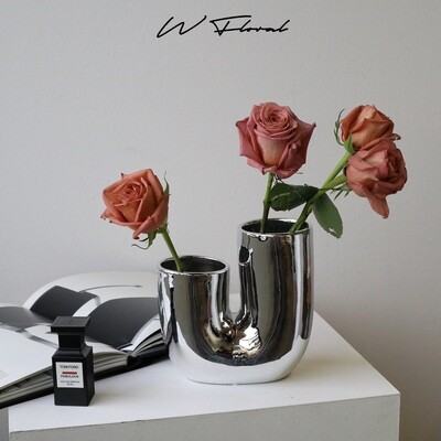 Contemporary silver-toned flower vase with architectural shape