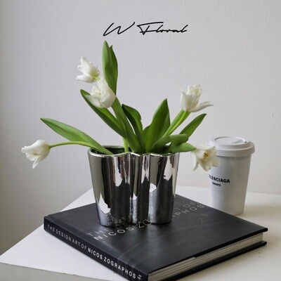 Silver-toned flower vase with organic cloud-inspired shape
