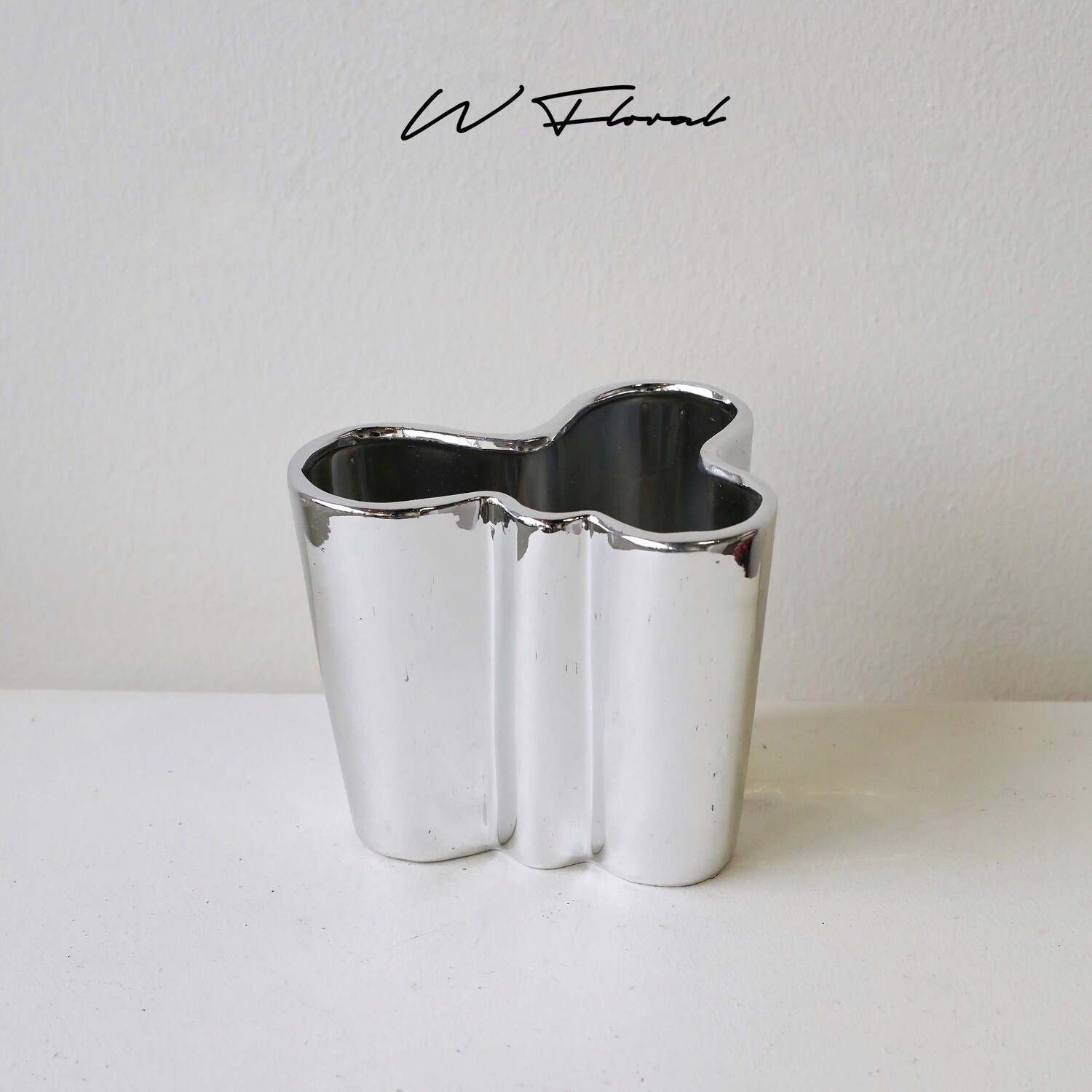 Sculptural silver cloud vase with fluid modern silhouette