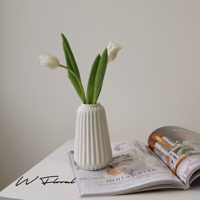 Geometric flower vase with origami-inspired folded design