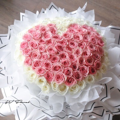 Grand round rose bouquet with pink roses arranged in a heart shape at the centre