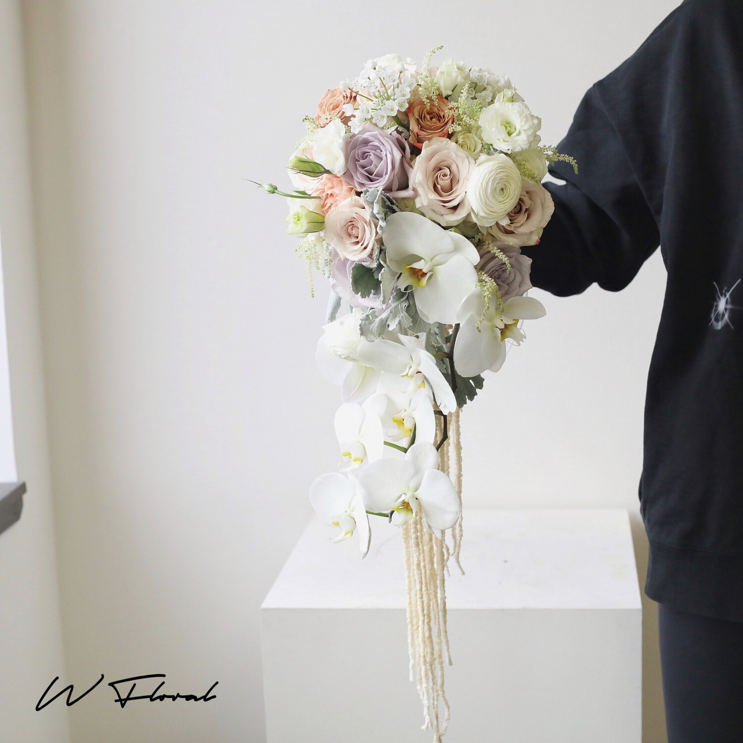 Luxury orchid wedding bouquet with roses and flowing details