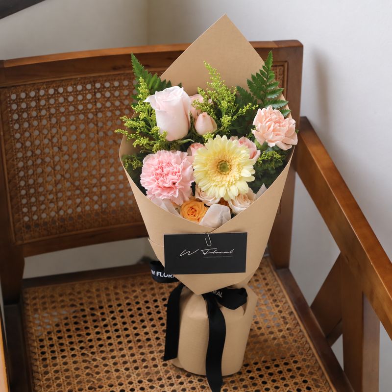 Small flower bouquet with roses gerbera and seasonal blooms