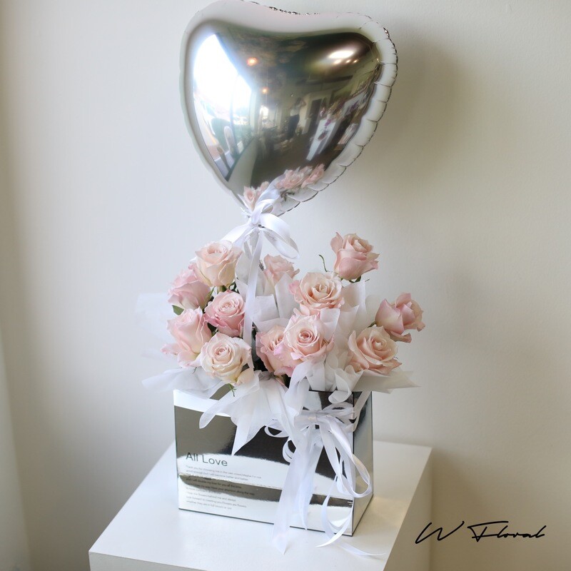 Premium pink roses in a flower box with heart-shaped balloon by W Floral Studio Toronto