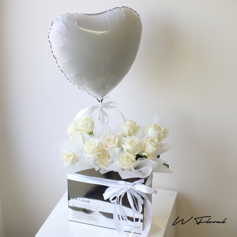 White rose flower box with white heart balloon by W Floral Studio Toronto