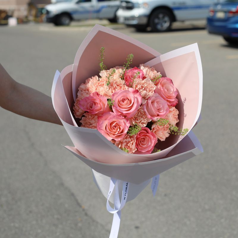 Soft peach flower bouquet with carnations and roses