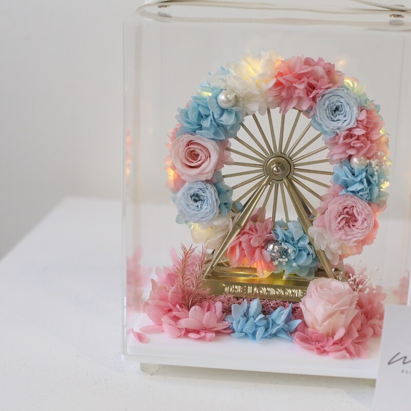 Pastel blue and pink preserved flower arrangement with LED lights
