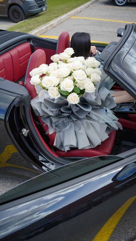 Premium white rose bouquet with elegant luxury wrapping