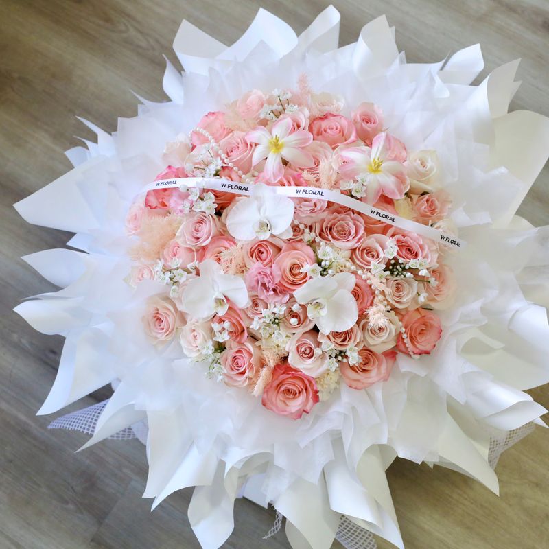 Grand pink mixed flower bouquet in a full round silhouette