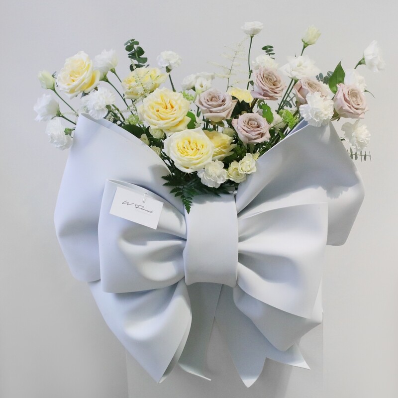 Garden flower box with oversized white rosette bow by W Floral Studio Toronto