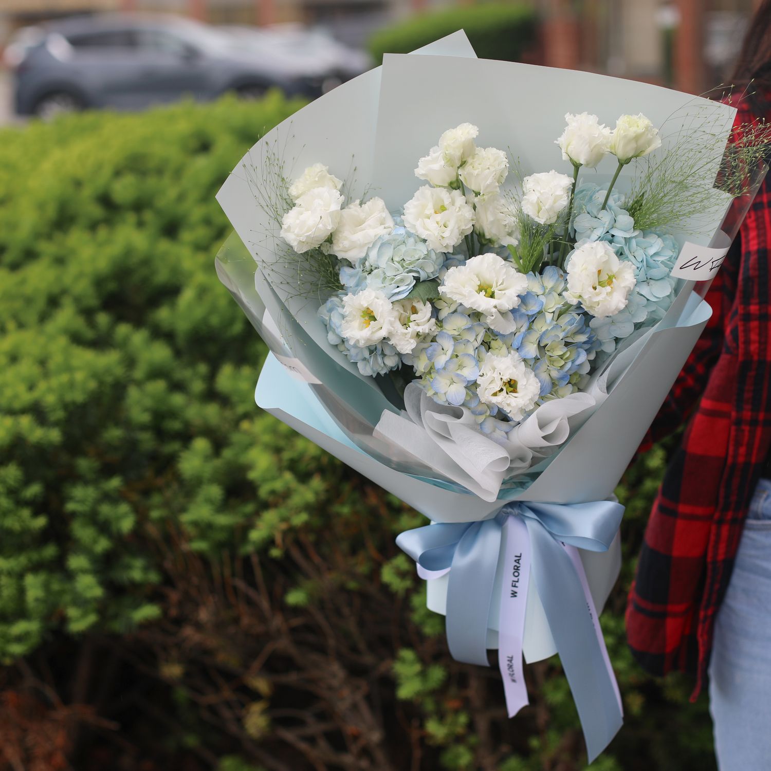 Blue hydrangea and white lisianthus bouquet by W Floral Studio