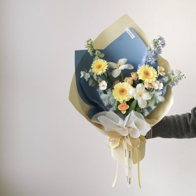 Sea Salt Cheese bouquet with blue delphiniums and yellow gerberas