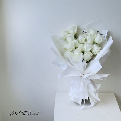 Elegant white rose bouquet in a clean minimalist style