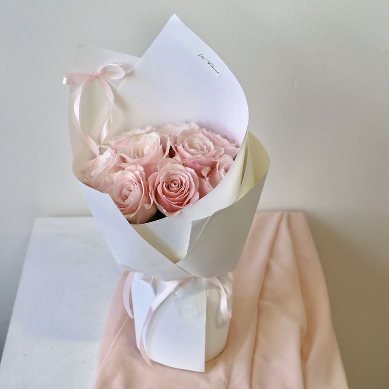 Romantic pink rose bouquet arranged in a full round silhouette