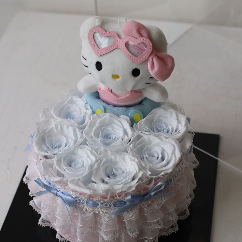 Icy blue preserved flower gift with adorable Hello Kitty plush