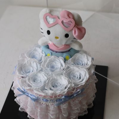 Icy blue preserved flower gift with adorable Hello Kitty plush