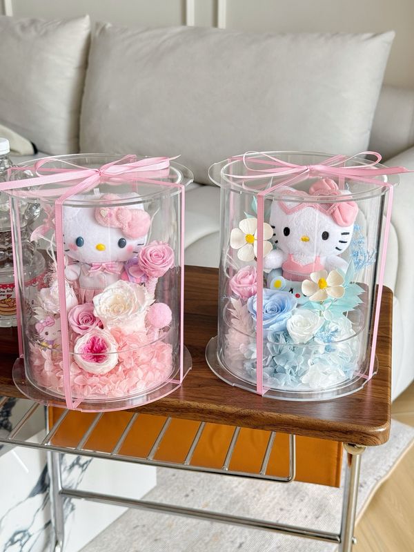 Light blue preserved flower arrangement with cute kitty plush accent