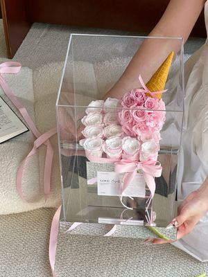 Blush pink and white preserved flower cake arrangement in Toronto
