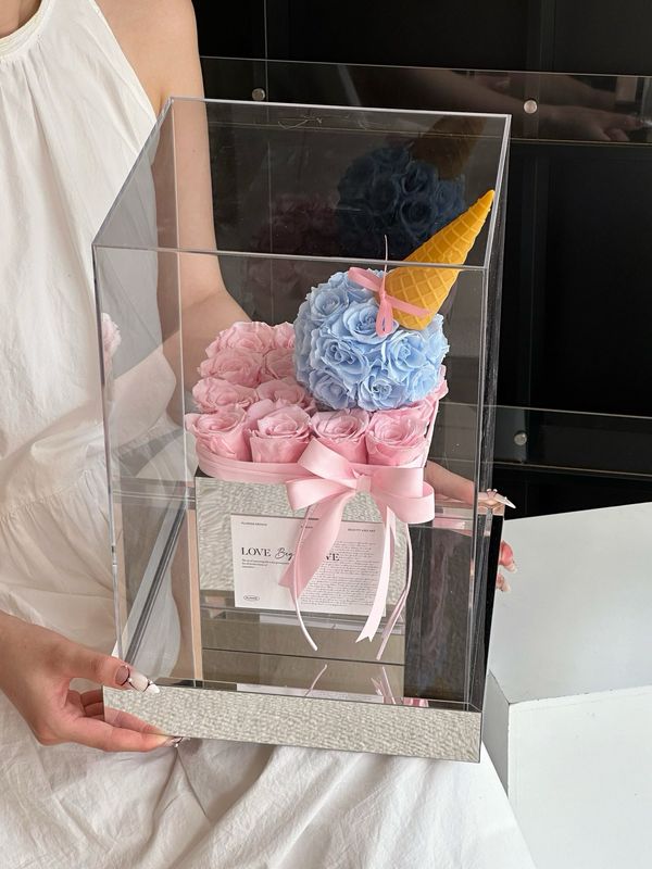 Pink and blue preserved flower arrangement in ice cream cake-inspired style