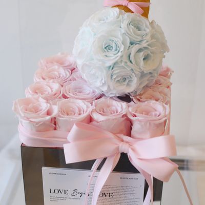 Pink and blue preserved flower arrangement by W Floral Studio